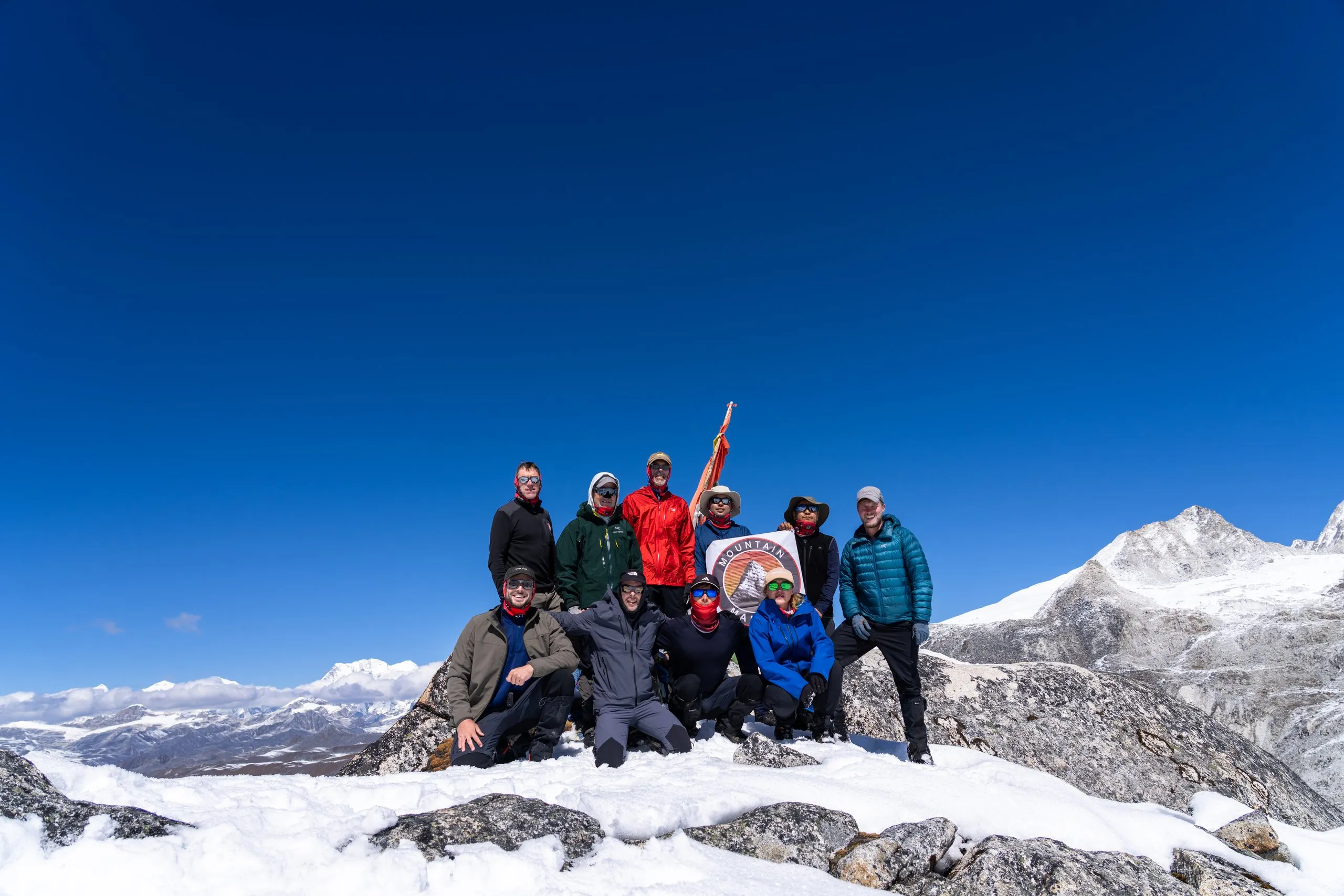 The team on a snowy pass